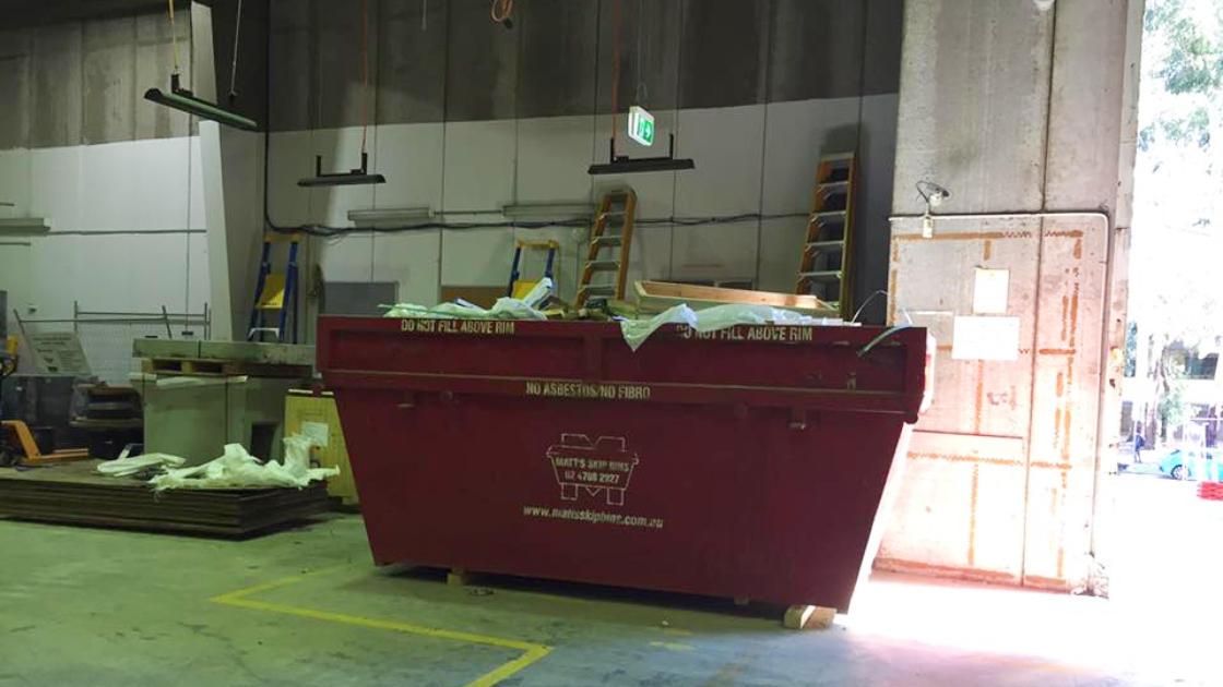 Sorting through skip bin waste